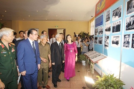 A delegation led by Party Secretary Nguyen Phu Trong and State President Truong Tan Sang attends an exhibition to commemorate the Geneva Conference in Ha Noi yesterday. The Geneva Agreement on the ceasefire in Viet Nam was an important step forward in the country's struggle for liberation, and confirmed its people's desire for peace. — VNA/VNS Photo Tri Dung